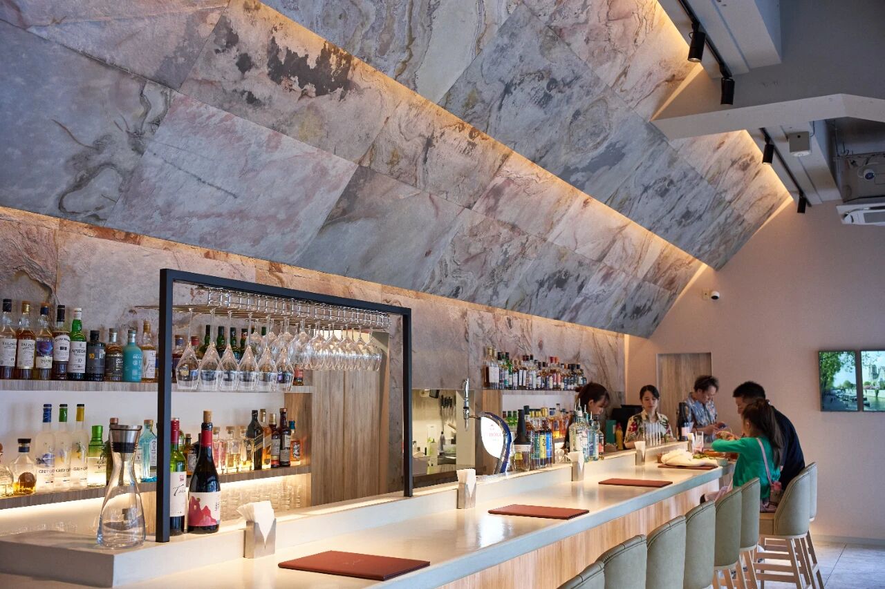 Indian Autumn natural stone veneer installed on bar ceiling and feature wall for architectural interior design