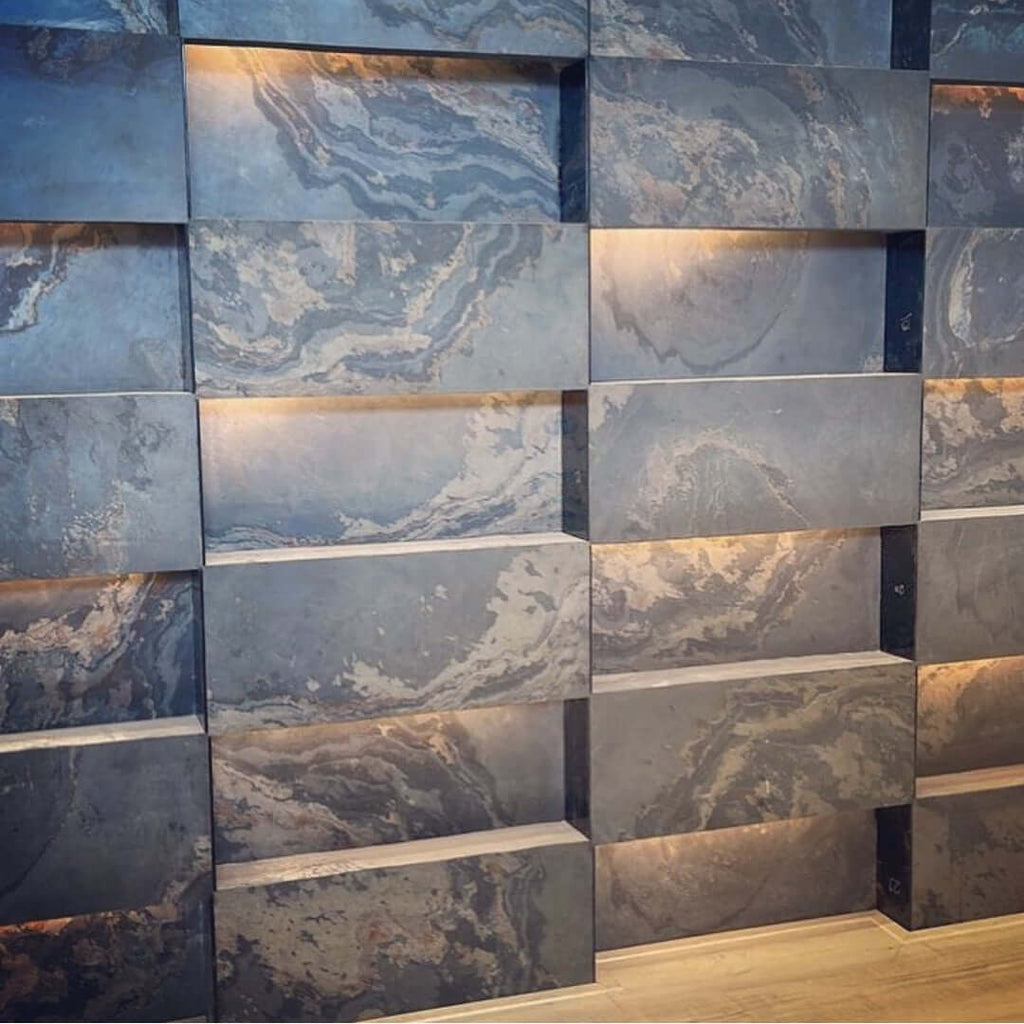 Interior stone veneer feature wall with blue-gray panels and beige streaks in grid