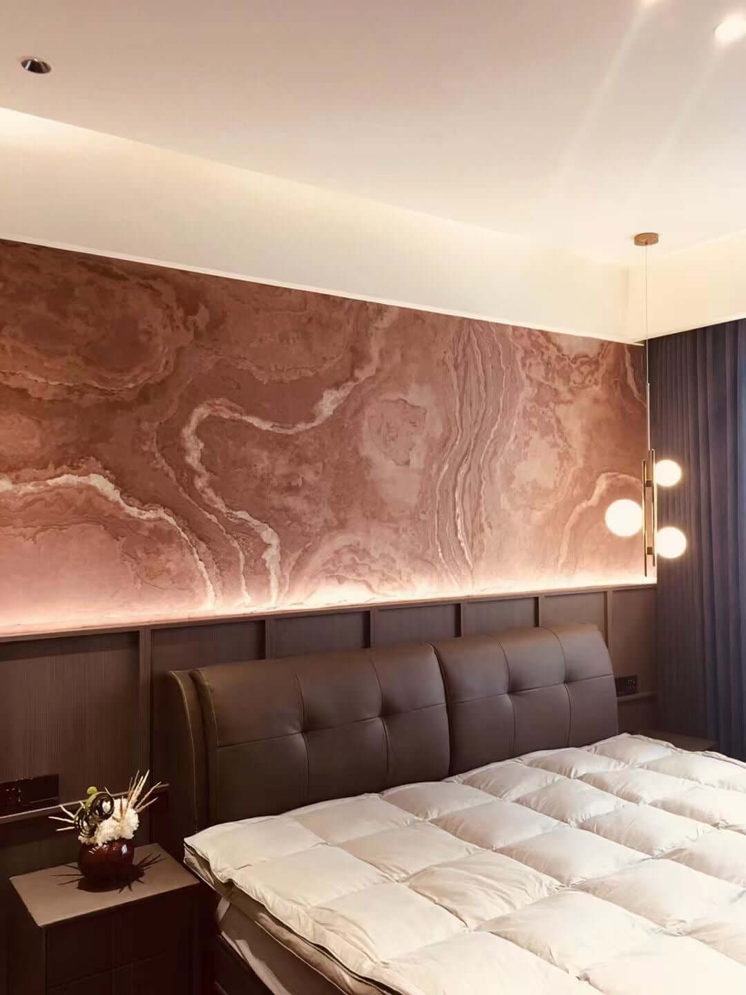 Terra red natural stone veneer feature wall with marble-like swirls