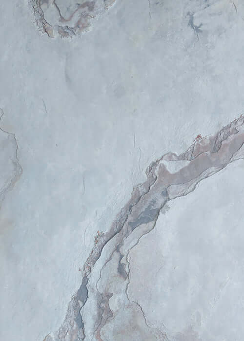 Grey and cream natural stone veneer panel with light pink veining