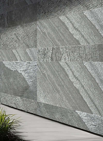 Exterior stone cladding panel with dark slate gray stacked-stone pattern