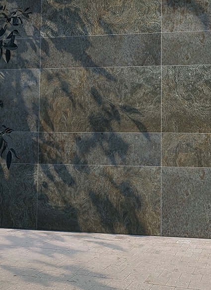 Gray textured stone-look exterior cladding panel with rectangular metal edging
