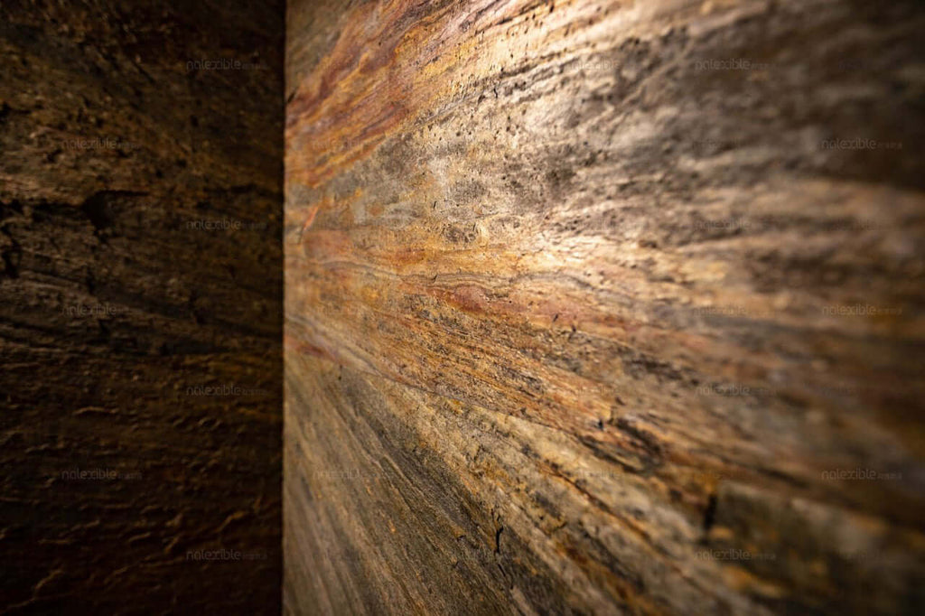Warm-toned stone veneer section with brown, tan, and copper streaks