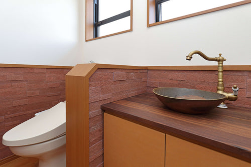 3D Terra Red peel and stick natural stone veneer applied on an interior feature wall