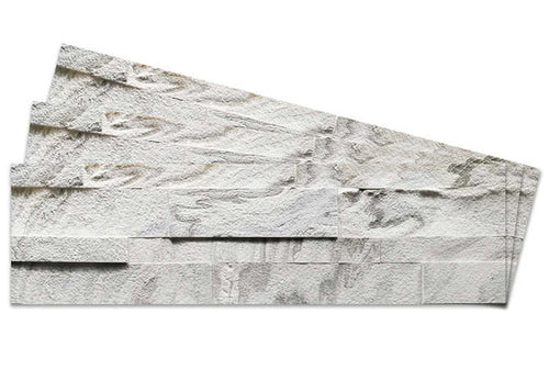 Peel-and-stick stone tile panel with textured white and gray rock pattern