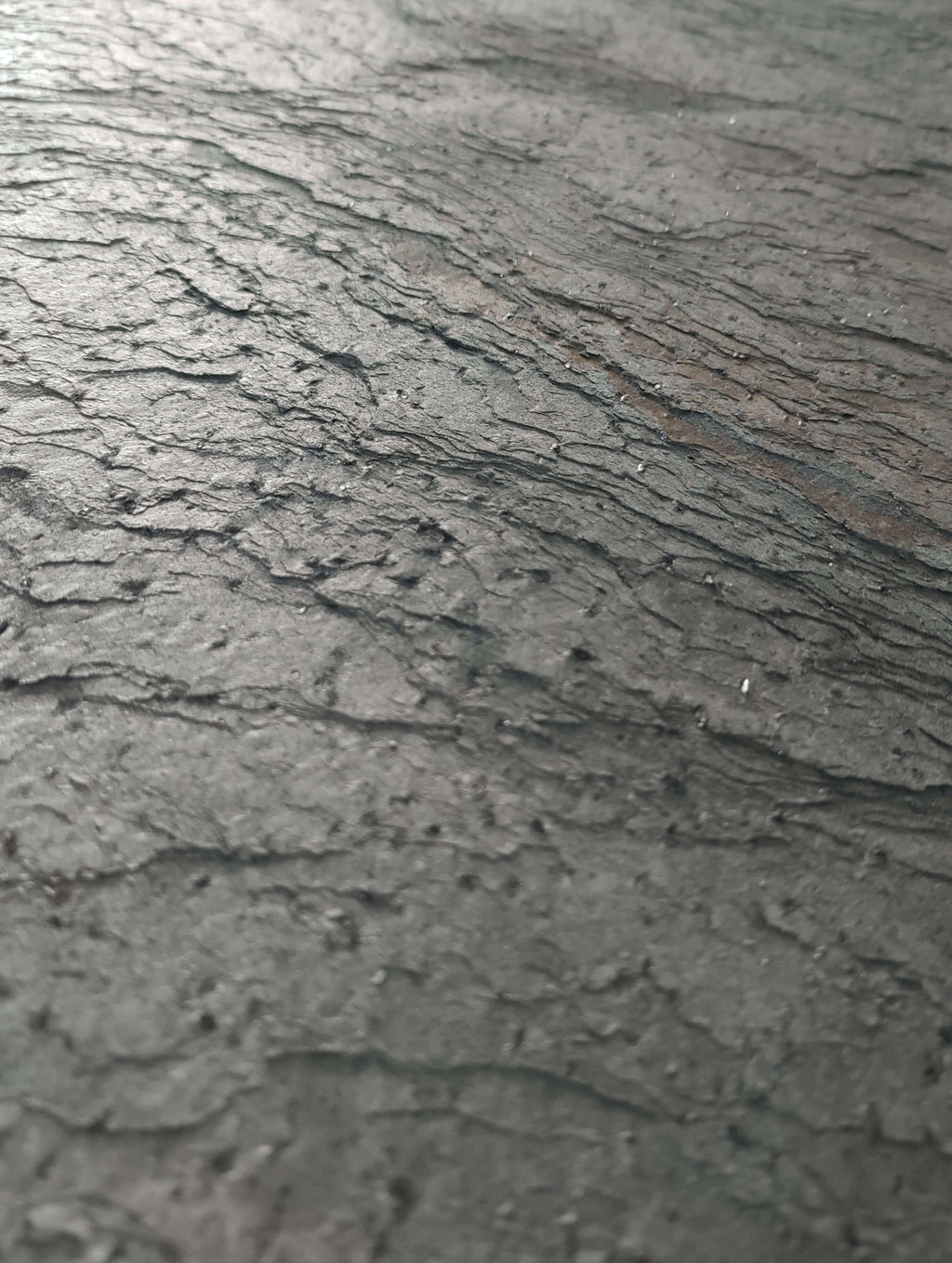 Silver grey natural stone veneer close-up showing mottled stone texture lines
