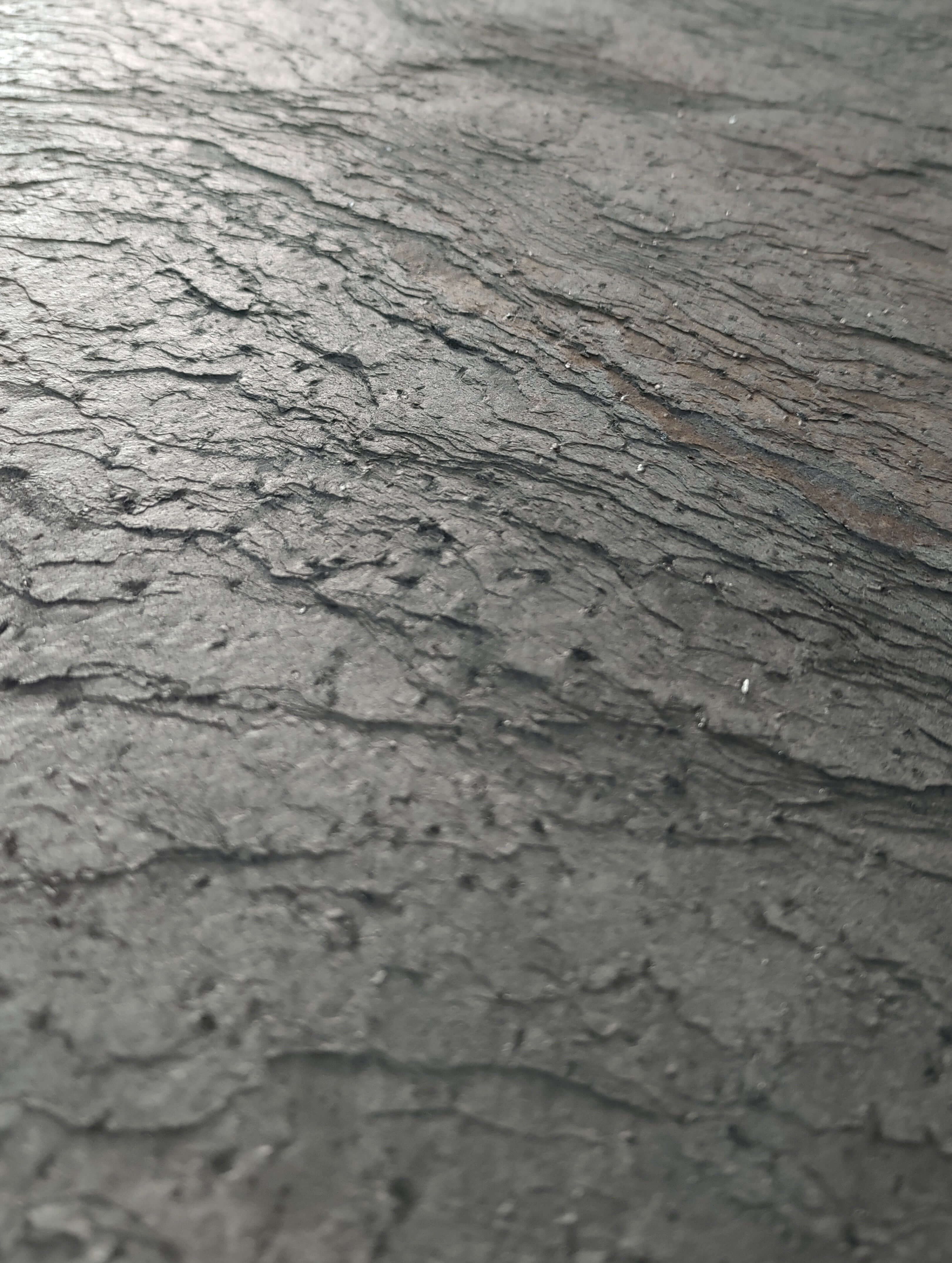 Silver grey natural stone veneer close-up showing mottled stone texture lines