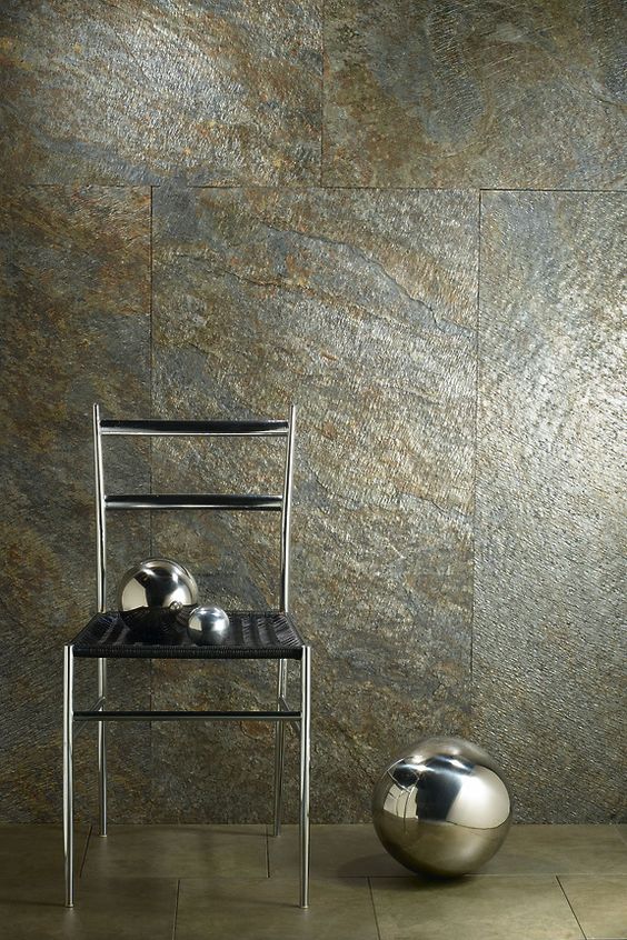 Silver and gold speckled natural stone veneer wall panel with stone-pattern texture