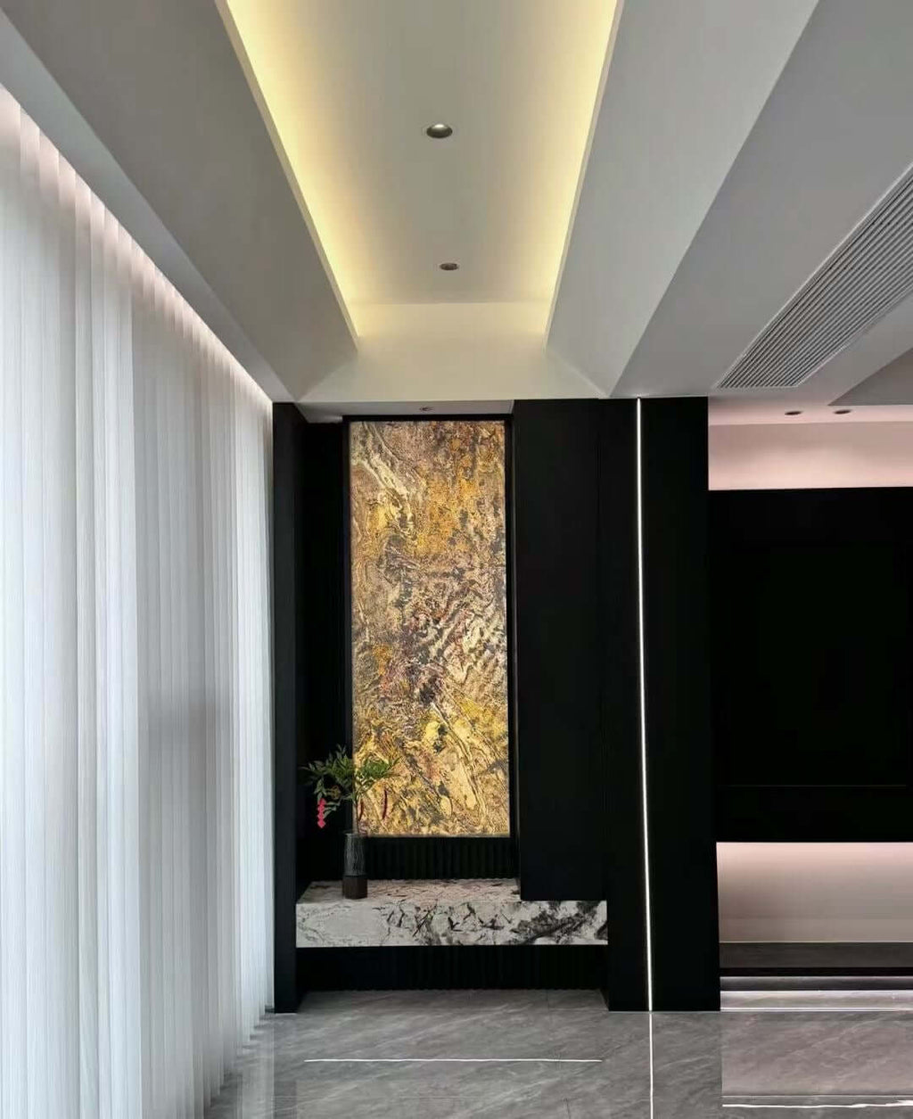 Abstract textured wall panel in yellow and gold with dark marbling