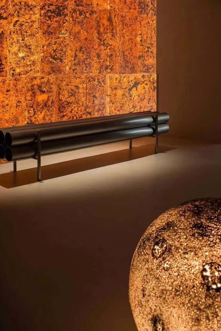 Terra red natural stone wall panel with gold-brown marbling detail