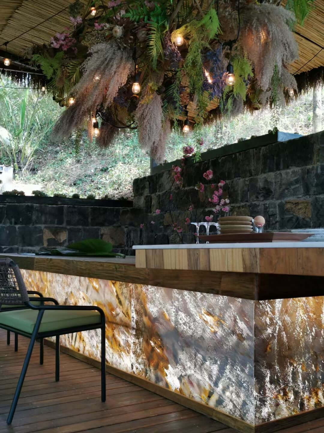 Translucent stone wall panels with yellow and silver mottled marble texture