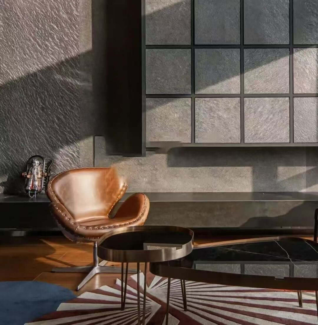 Black stone veneer wall panels and niche grid behind counter
