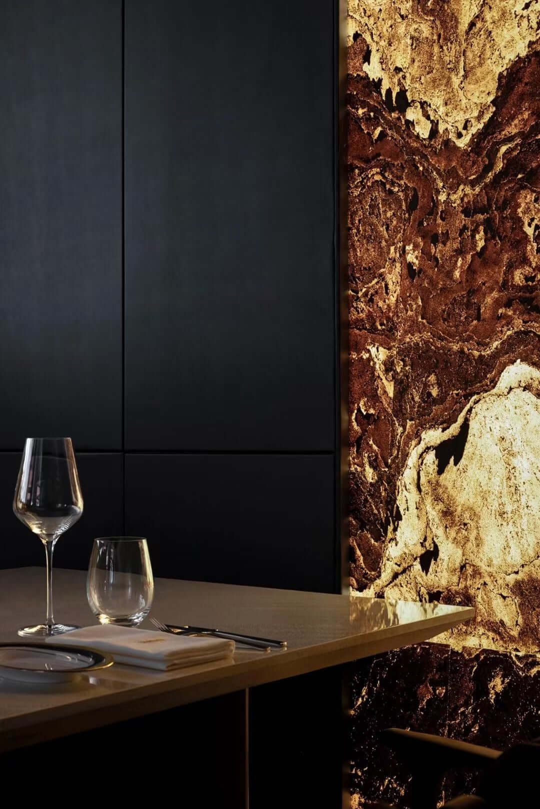 Terra red natural stone wall panel with bold rust veining and cream patches