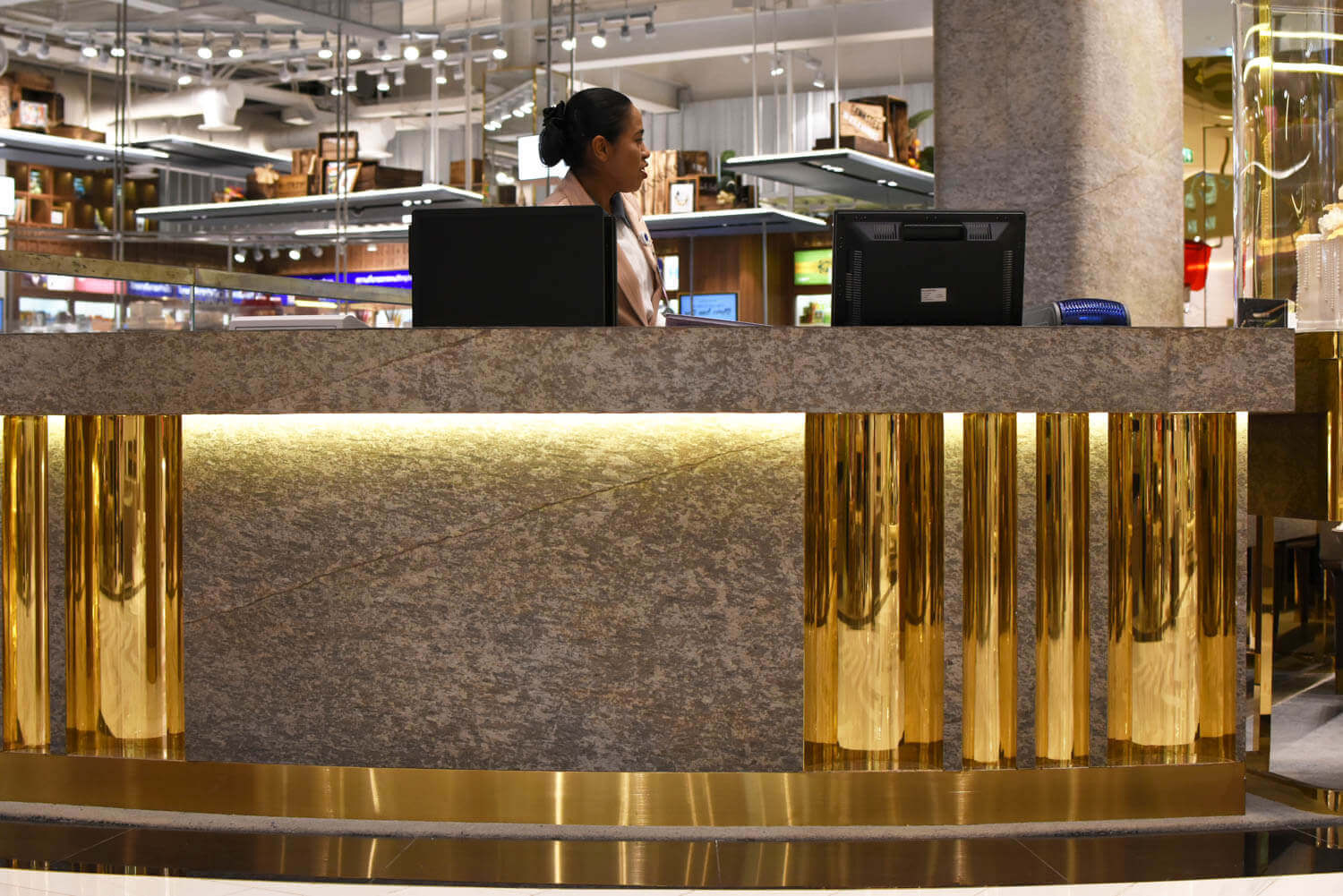 Gold-toned metallic and gray stone veneer front panel with mottled stone texture