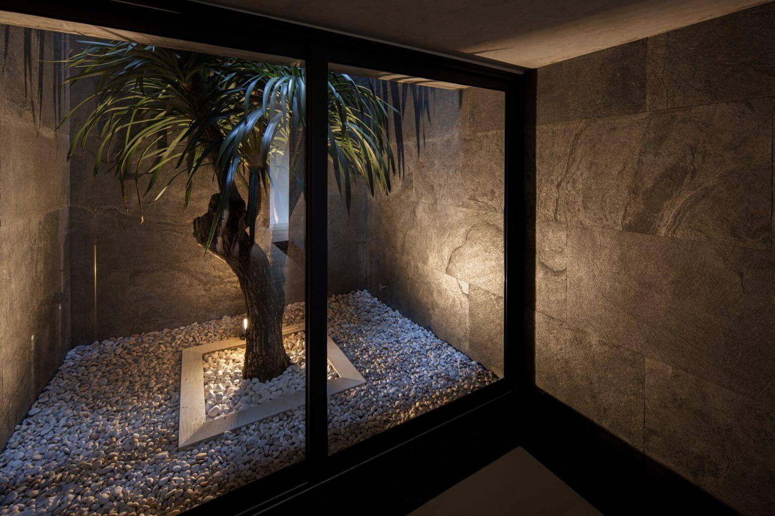 Silver grey natural stone veneer interior niche walls with rough stone texture