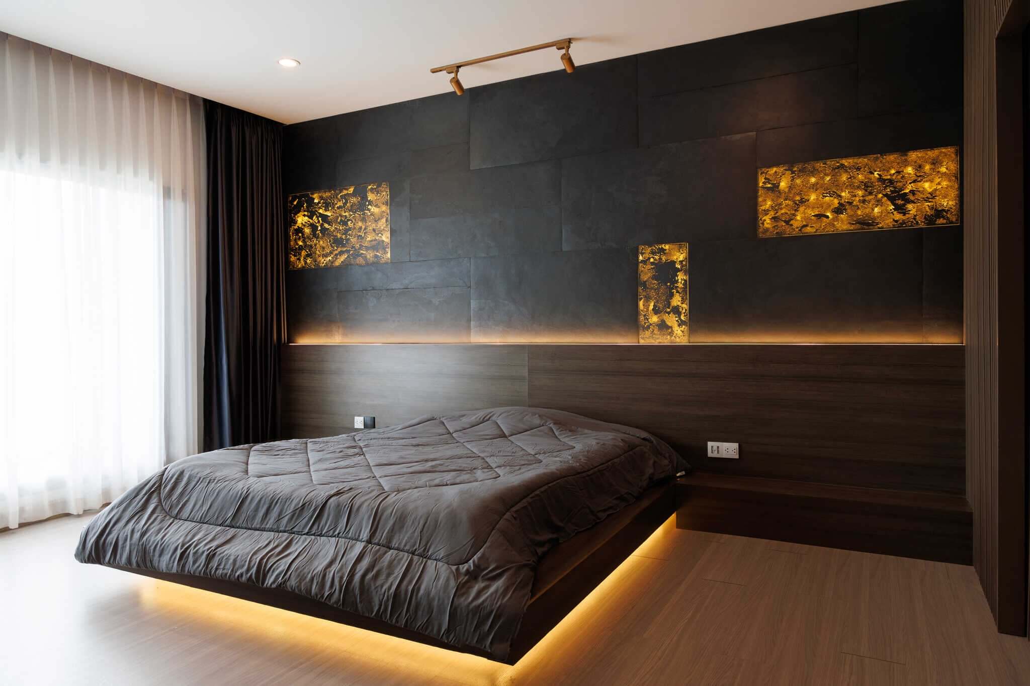 Translucent natural stone sheet feature wall with gray, speckled finish and warm lighting