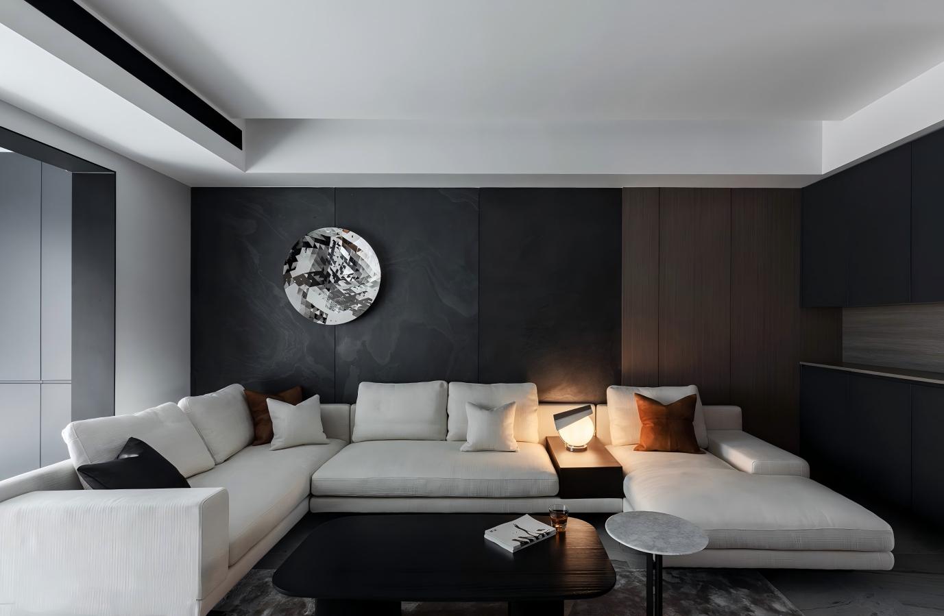 Modern living room interior featuring Nalexible Black ultra-thin natural stone wall panels with a light sofa, timber finishes and soft lighting.