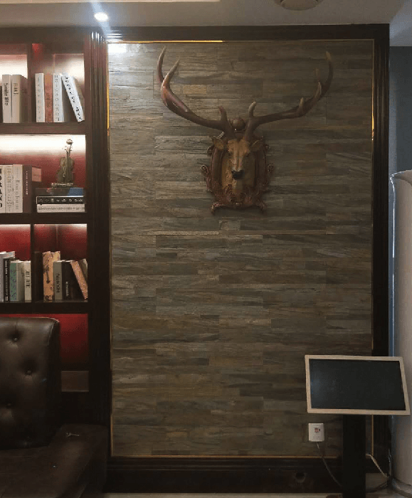 Peel-and-stick stone wall tile panel with stacked horizontal seams in gray and brown