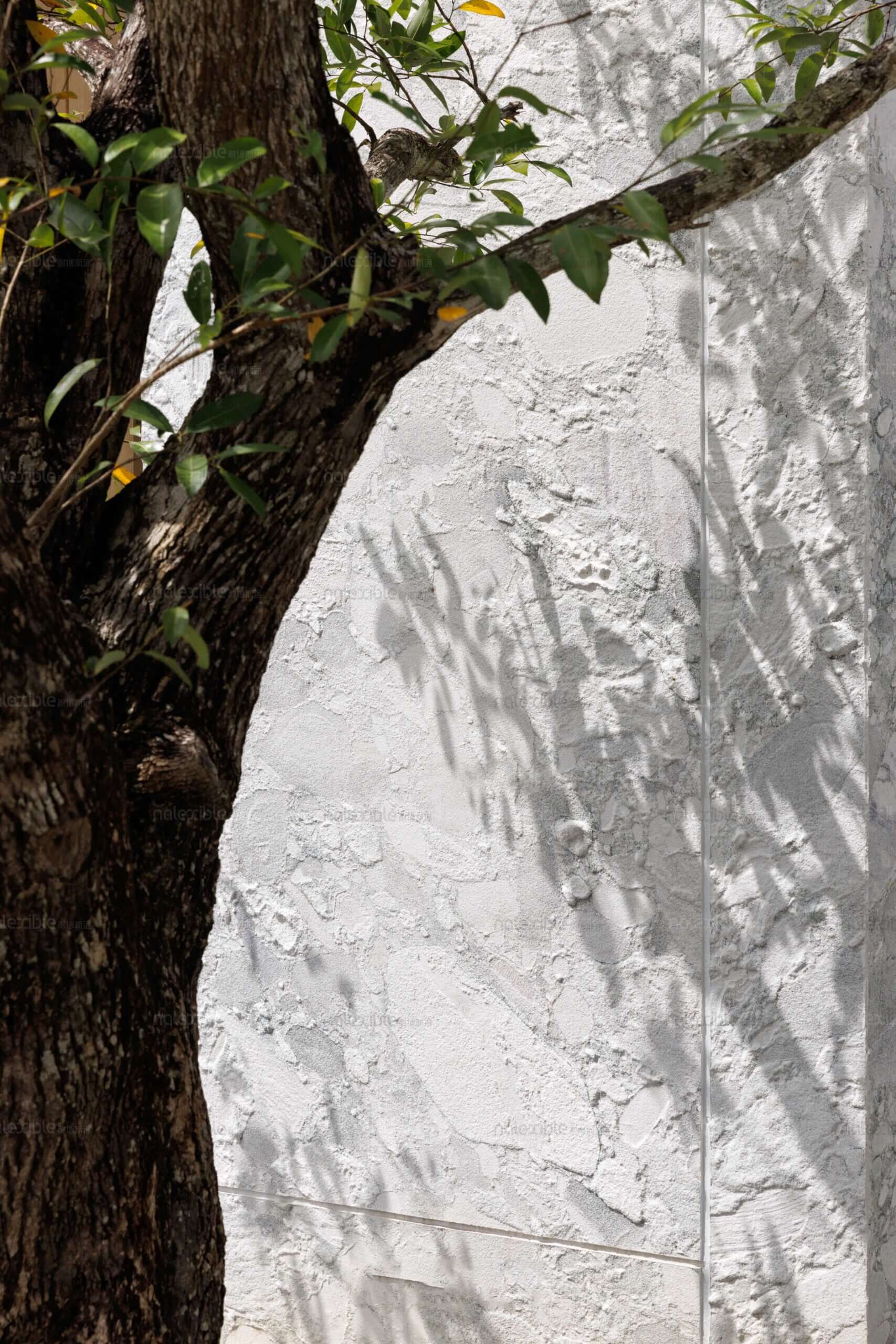 Granite stone veneer siding panel in light gray with subtle mottled veining.