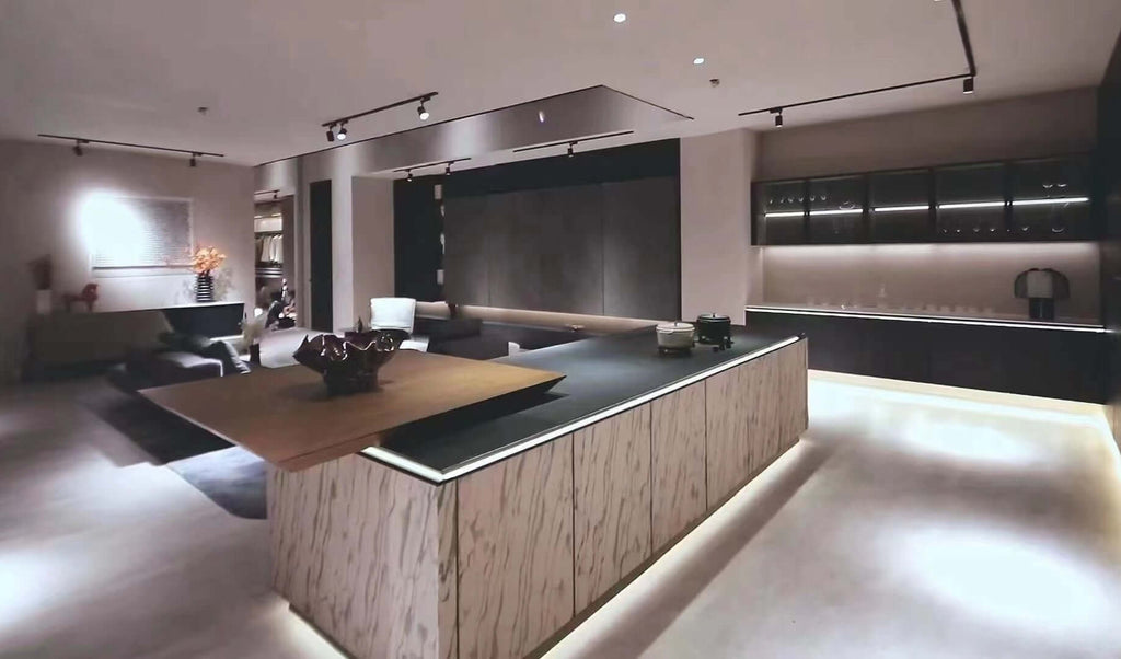 Kitchen interior with stone veneer wall cladding featuring white-gray marble veining