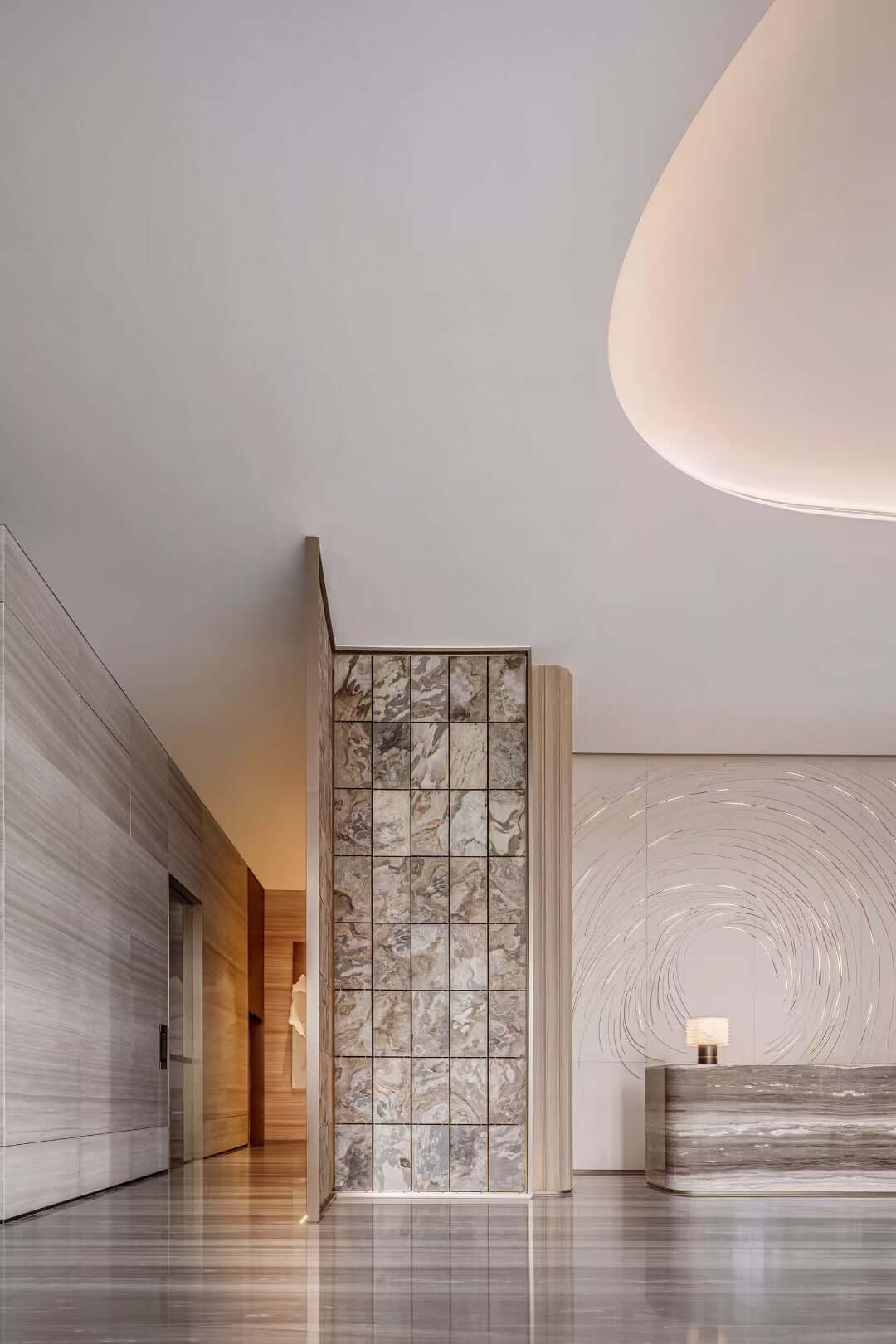 Stone veneer panel with rectangular grid pattern in cream and gray speckled stone