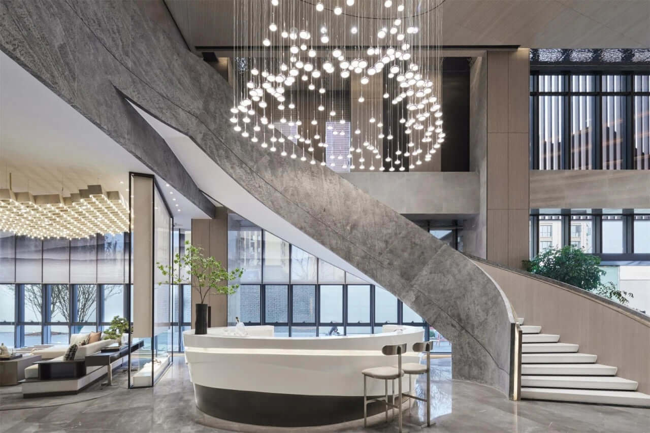 Silver grey natural stone veneer cladding along an indoor stairwell wall