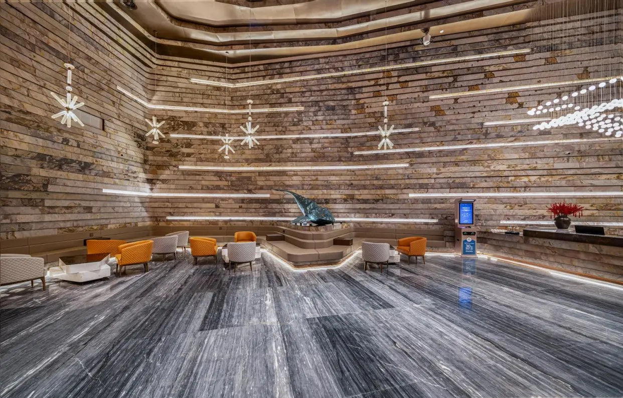 PLATLMOR Intercontinental Hotel lobby in Hangzhou featuring Sanjayani White ultra-thin natural stone veneer on large curved interior wall surfaces
